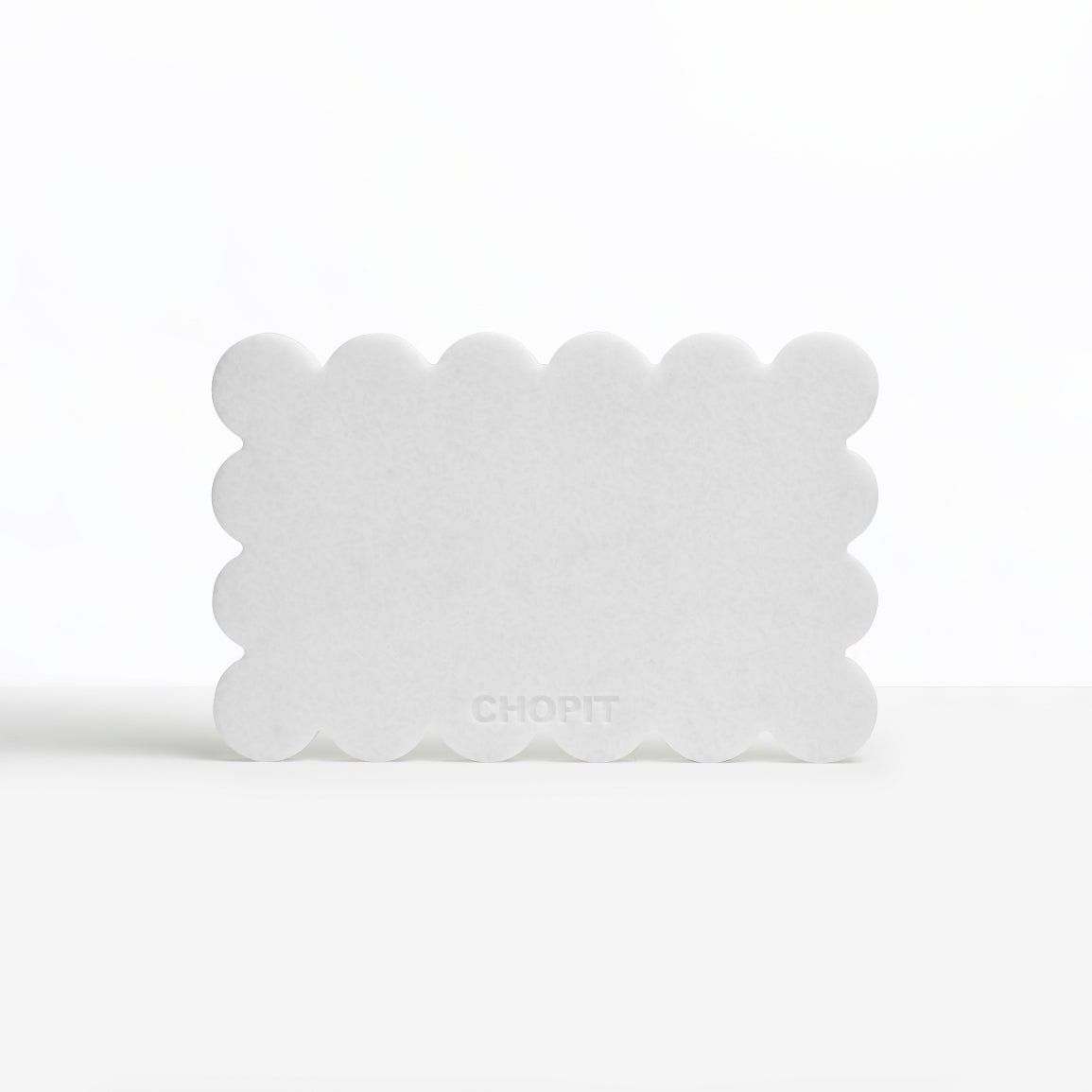 Pearl white CHOPIT chopping board with scalloped edge. Art for your kitchen backside