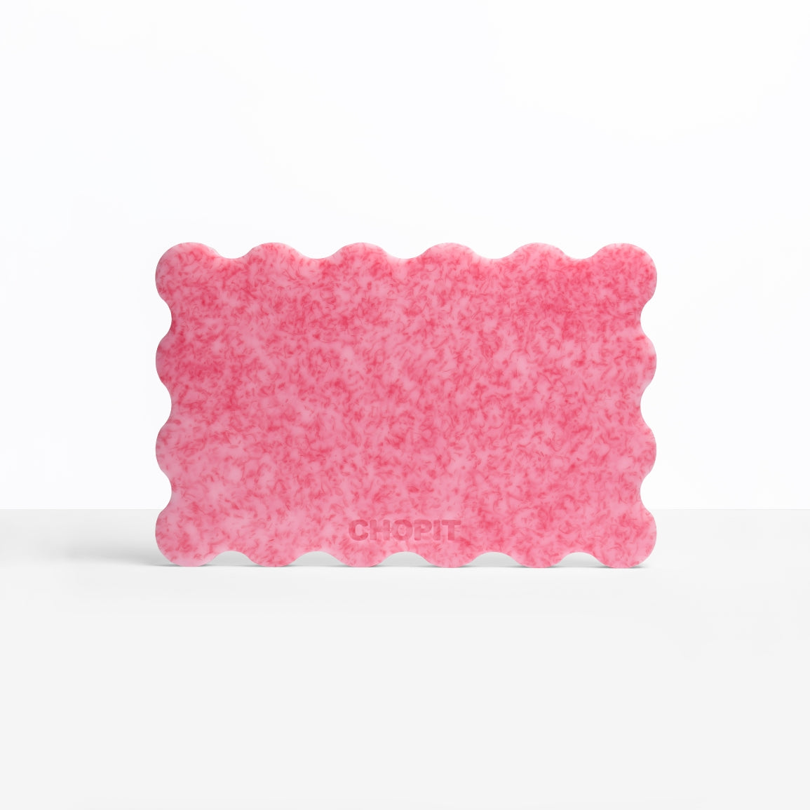 Bubblegum Pink CHOPIT chopping board with scalloped edge. Colourful chopping board for your kitchen backside