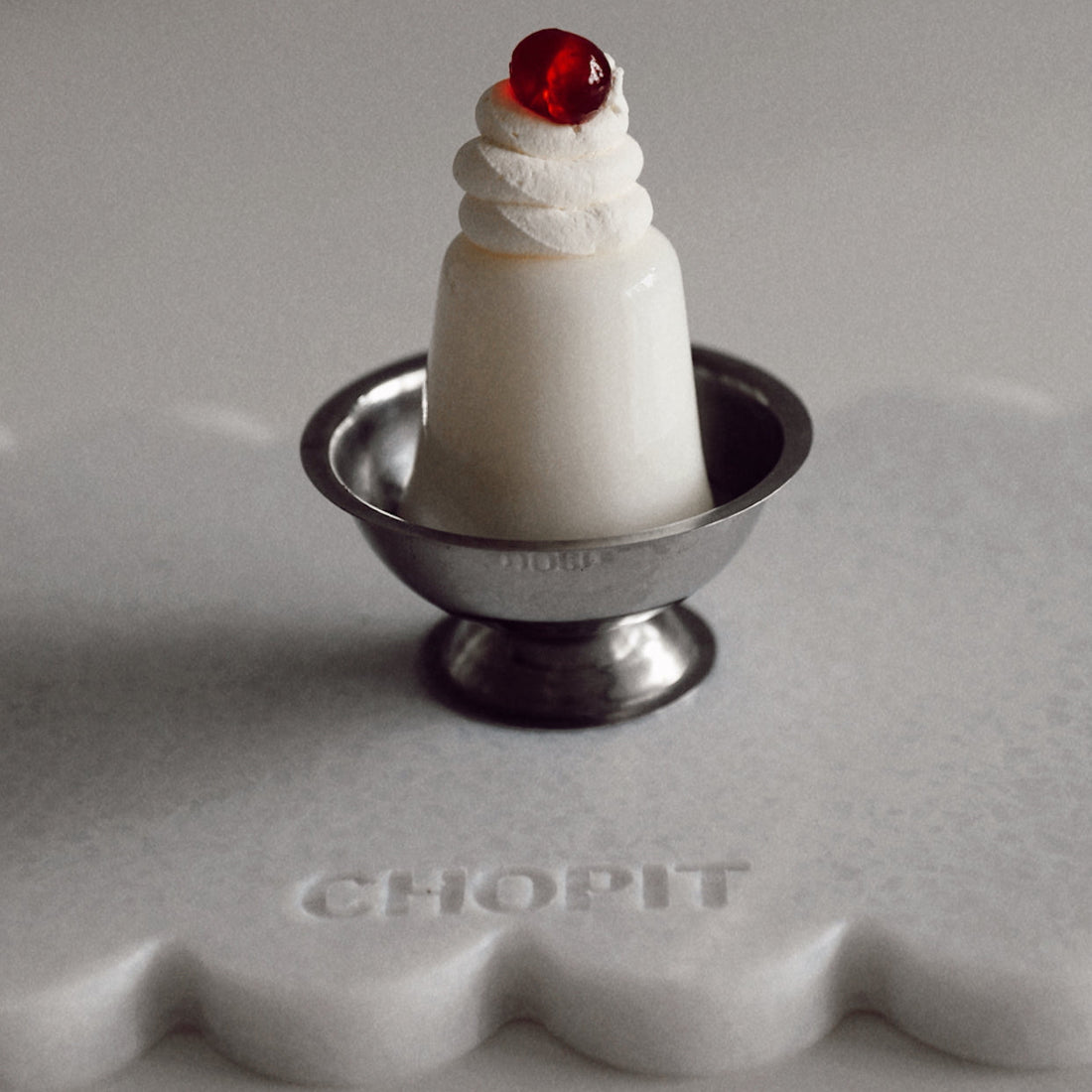 Pearl white CHOPIT chopping board with scalloped edge. Art for your kitchen