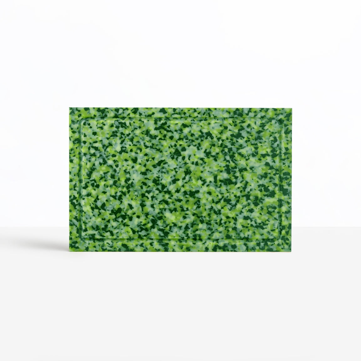Moss green CHOPIT chopping board featuring juice groove. Colourful chopping board for your kitchen.
